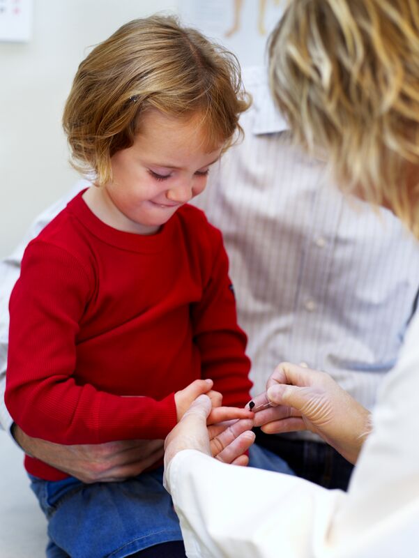 Capillary Sampling with a HemoCue Hb 201+ Microcuvette on a child's finger