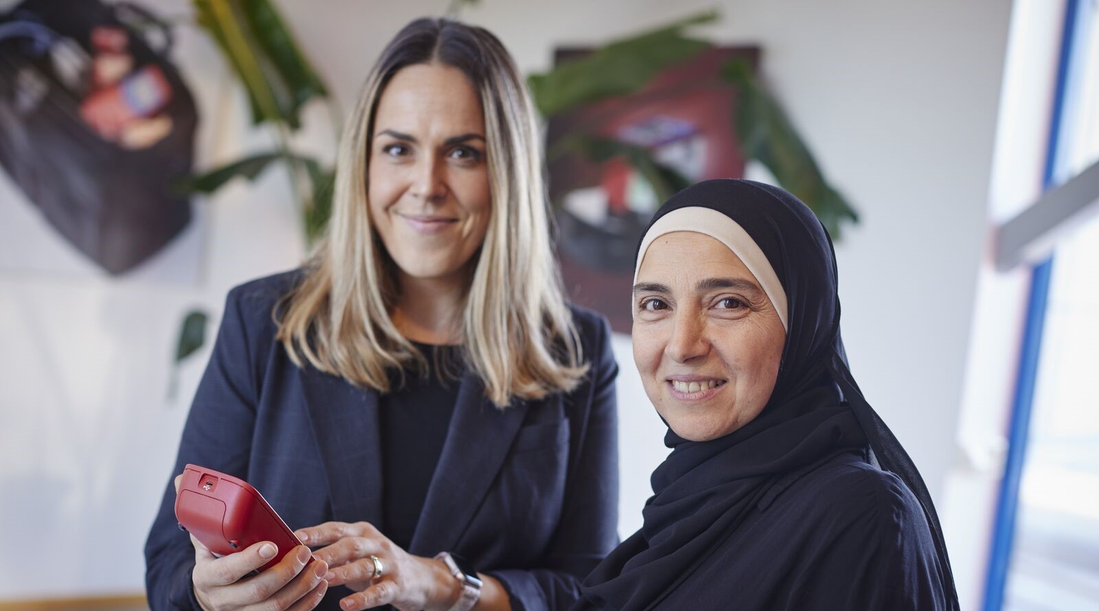 Two female colleagues smiling