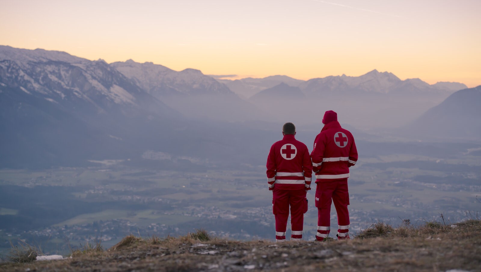 Healthcare professionals looking at scenic mountains