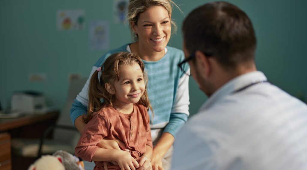 Young girl at doctor's office with mother